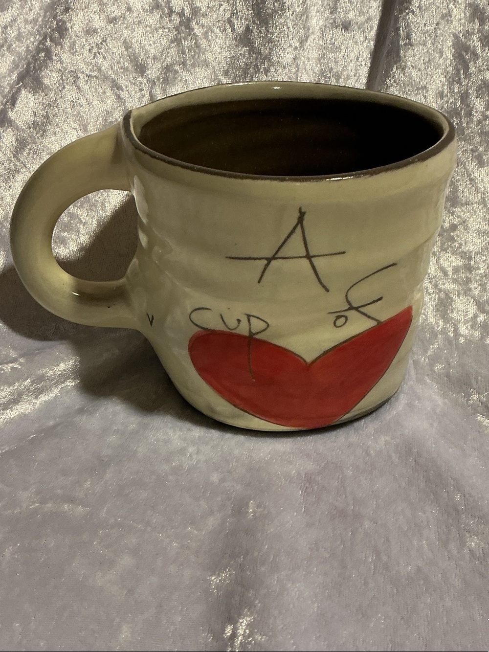 Handcrafted Cream Ceramic Mug Reads 
A Cup of Love -> Drink It. (See pix)